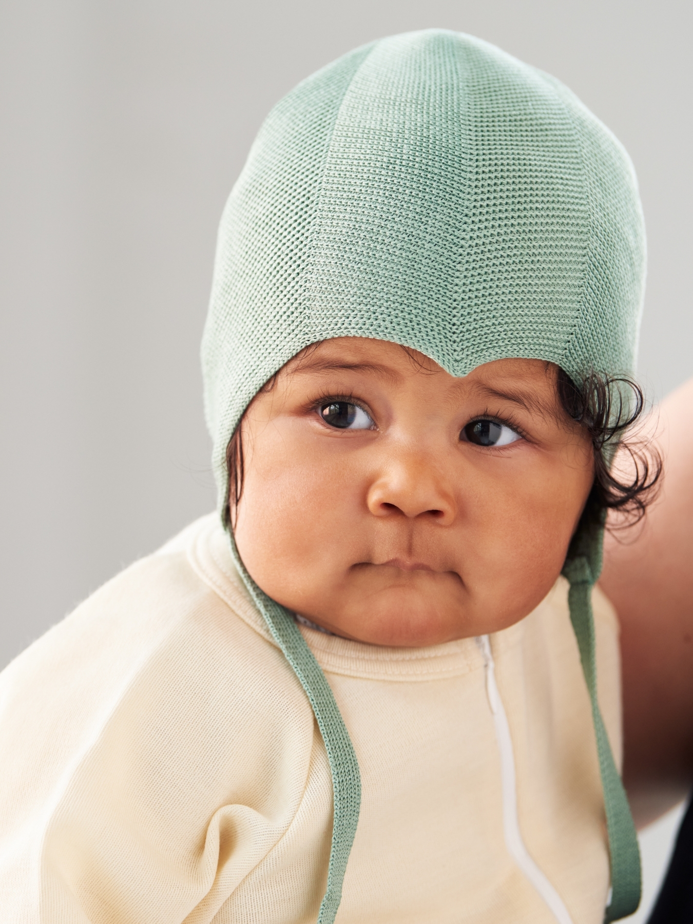 Ruskovilla's green silk bonnet for babies
