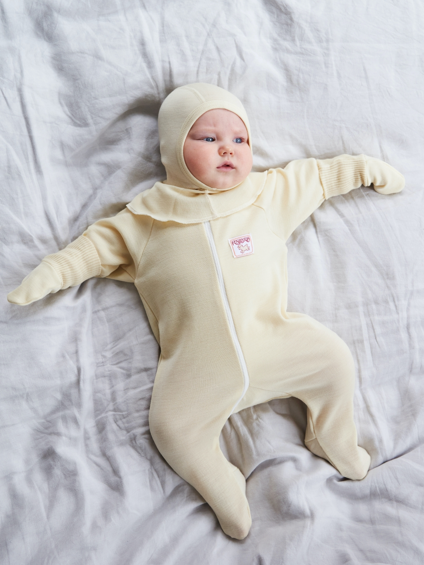 Ruskovilla's baby organic merino wool overall in white