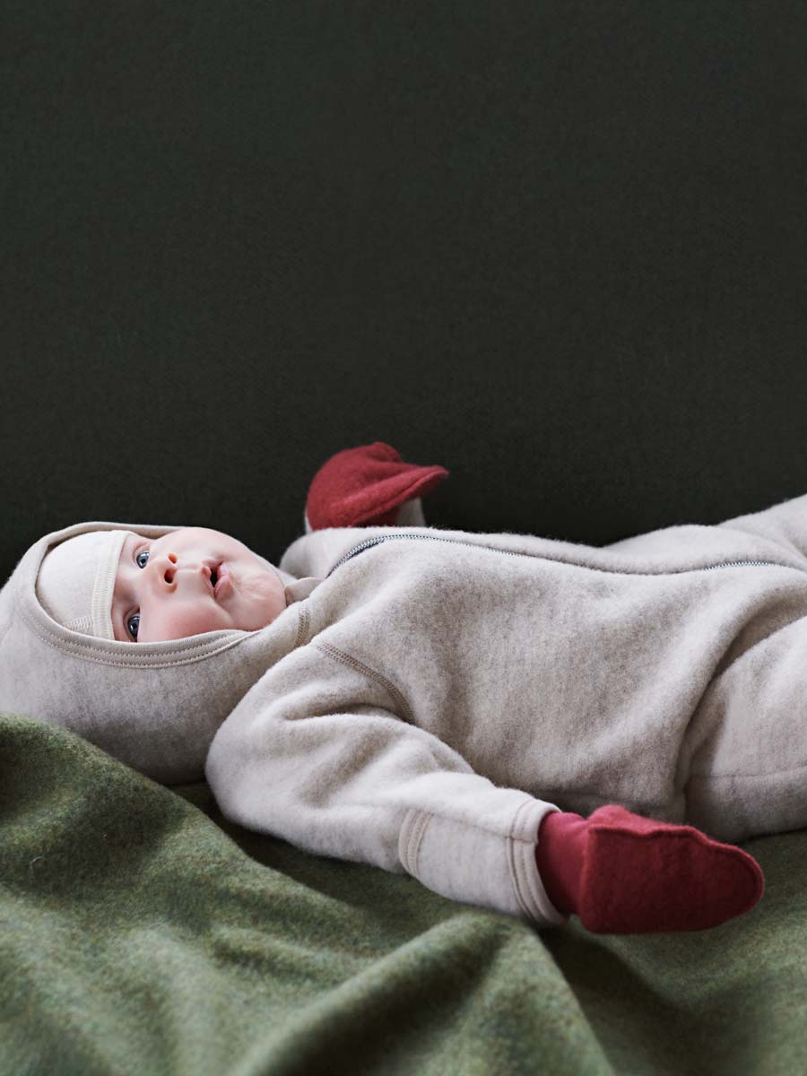 Ruskovilla's babys organic merino wool fleece mittens in wild rose color and wool fleece overall in dune colour